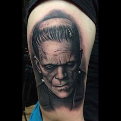 a man with a creepy face on his arm