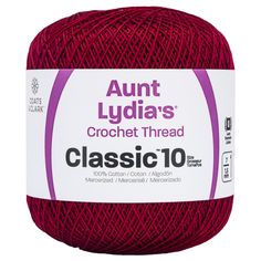 red yarn ball with the words'classic 10'in white on top and purple trim