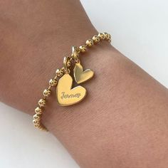 Our adorable heart design is simple but stunning. Totally darling with no engraving or personalize with your favorite human or doggos name. This is your party and you can engrave what you want to!

Bracelet: 3mm beads | Heart Tag: 15mm | Chain: 6.75" + 1" Extension
Add more personalized heart charm here. Personalized Charm Bracelet With Round Beads For Valentine's Day, Personalized Charm Bracelet For Valentine's Day, Valentine's Day Personalized Charm Bracelet With Round Beads, Personalized Heart Bracelet With Round Beads For Valentine's Day, Gold Name Bracelet With Heart Beads For Friendship, Engraved Heart Bracelet For Valentine's Day, Custom Name Heart Bracelet For Valentine's Day, Valentine's Day Friendship Name Bracelet With Heart Charm, Mother's Day Heart Bracelet With Round Beads