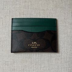 Nwt Coach Signature Slim Id Credit Card Case Holder In Brown And Dark Pine Leather Brand: Coach Details: Three Credit Card Slots And Id Window Size: 4” L X 3” H Color/Material: Dark Pine Leather And Signature Canvas In Brown Condition: Nwt Window Size, Signature Canvas, Green And Brown, Card Case, Coach Bags, Card Slots, Slots, Credit Card, Bag Lady