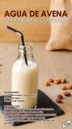 a glass bottle filled with milk sitting on top of a table