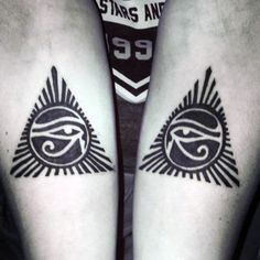 two tattoos on both legs with an eye in the middle and sun at the bottom