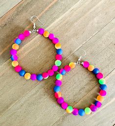 These jumbo hoops are the cutest.  They are delicately made with colorful neon beads and are a bit over 2 inches in diameter.  The shades of neon in these lovelies are pink, orange, green, indigo, and purple.  The colors are so fun!  I have a vast collection of seed beads.  Simply leave me a message if you have other colors that you would like to see in this type of hoop.  They will jazz up your outfit or make the perfect gift for the lover of hoops! ~I use high quality hypoallergenic materials along with many different colors and types of beads.  I work hard to create beautiful pieces and to provide excellent customer service.   Packaging All of my earrings come packaged in a pretty drawstring bag with my deepest gratitude to all customers. They make perfect gifts. Other big hoops in the Neon Crafts, Hoop Earrings Handmade, Handmade Hoop Earrings, The Lover, Large Hoop Earrings, Beaded Hoop Earrings, Beaded Hoops, Gifts For My Sister, Small Rings