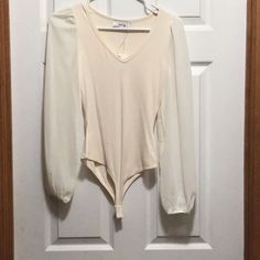 Nwt Size Xs Long Sleeve Sheer Sleeves Body Ribbed Cream Color Lots Of Stretch Spring Beige V-neck Bodysuit, Beige V-neck Bodysuit For Spring, Cream Bodysuit For Spring, Chic Cream Bodysuit For Spring, Sage Top, Women Bodysuit, Sheer Sleeves, Womens Bodysuit, Cream Color