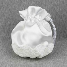 a white satin bag with lace on the bottom