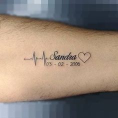 a man's arm with a heartbeat and the words, sandra on it