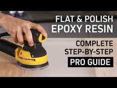 a person sanding wood with a polisher and epox resin resin resin resin