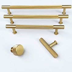 an assortment of brass handles and knobs on a white background with space for text