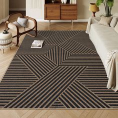 a living room with a large rug on the floor