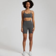 This high waist shorts and sports bra set comes in a variety of stylish colors and designs, making it easy to mix and match with your other workout clothes. The shorts and sports bra have a form-fitting design, providing a flattering and comfortable fit. The butt lifting feature of the shorts helps to accentuate your curves, making you feel confident and stylish. Product Specifications: Product Features: Super elastic, Soft and stretchy fabric, Butt lifting, High waist, Seamless Main Fabric Comp Sporty Crop Top With Built-in Shorts, Sporty Crop Top With Built-in Shorts For Gym, Workout Activewear With Built-in Bra, Short Length, Compressive Athletic Shorts For Gym In Gray, Compressive Gray Athletic Shorts For Gym, Gray Compressive Athletic Shorts For Gym, Gray Sports Bra For Summer Workout, Sports Shorts With Built-in Bra, Gray Athleisure Biker Shorts For Yoga