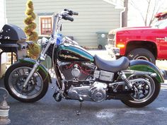 a motorcycle parked in front of a red truck