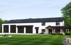 a large white house with two garages on the front