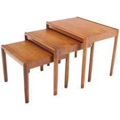 three wooden tables sitting on top of each other