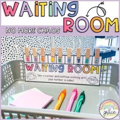 there is a sign that says waiting room with pens and markers on the tray in front of it