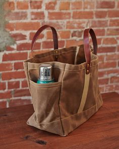 a brown bag with a bottle in it sitting on a table