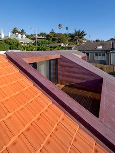 the roof of a house with wooden shingles