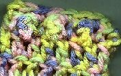 a pile of yarn sitting on top of a green surface