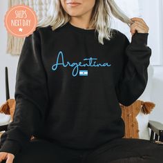 If you're looking for a thoughtful and practical gift, our apparel is sure to be appreciated by anyone who receives it. These Argentinian sweatshirts are handmade to order on an ultra-soft crewneck that will quickly become your go-to apparel item! Our trendy Argentina hoodies are made with eco-friendly water-based ink that feels good and lasts longer! You will never want to take it off! ♥Sizing info♥ *Unisex sizing. *Order your true size for a more fitted feel. Size up for a slouchier look ♥Care Black Casual Hoodie As Gift, Casual Black Hoodie As Gift, Black Casual Sweatshirt Gift, Casual Hoodie With Name Print, Casual Hoodie Sweatshirt For Gift, Casual Hoodie Sweatshirt As Gift, Casual Hooded Sweatshirt With Name Print, Casual Crew Neck Hoodie As Gift, Casual Crew Neck Hoodie With Name Print