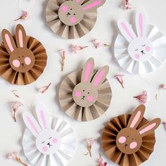 four paper bunnies with bunny ears on them