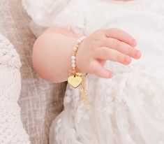 NEW! From our Timeless Collection, 14k gold-plated keepsake baptism gift "Baptism to Bride®" bracelet. This special keepsake will be a treasure that can be worn on her baptism day and then cherished again when she has her first communion, and becomes her "something old" on that special day when she becomes a bride. This is designed with 14K gold-plating (over .925 sterling silver) using all precious metals, high-quality freshwater pearls, high-end crystals, and is hand-beaded here in the USA. Th Elegant Bracelet Jewelry For Baptism, Baptism Bracelet Girl, Personalized Gold Name Bracelet For Baptism, Personalized White Pearl Bracelet For Baptism, Pearl Charm Bracelet For First Communion, Lds Gifts, Bride Bracelet, Keepsake Baby Gifts, Flower Girl Bracelets