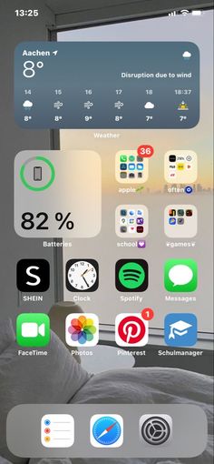 an iphone screen showing the home screen with icons and other things on it's display