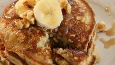 pancakes with bananas and walnuts on a plate