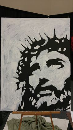 a black and white painting of jesus with his head in the center on a canvas