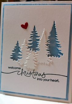 a handmade christmas card with pine trees and a heart on the front that says, welcome christmas into your heart