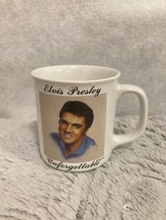 an elvis presley mug is shown on a white blanket