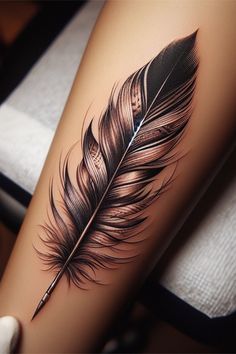 a black and white feather tattoo on the right leg, with a pencil in it