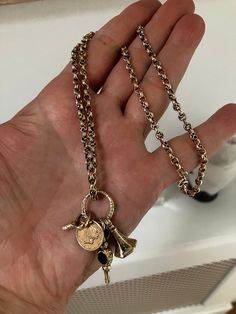 Gorgeous antique 9ct gold watch chain necklace, with a fob, two watch keys and a rare 22ct gold one dollar coin, dated 1853 hanging from the chain. The catch is a modern spring ring catch. CHAIN LENGTH: 20 inches long ( 50.8cm long ) TOTAL WEIGHT: 15.7g CHAIN THICKNESS: 4mm CONDITION: Good for age.  This beautiful chain has been professionally checked, cleaned and polished. Comes in a new box. Chain With Charms, Antique Gold Necklace, Gold Dollar, Necklace Antique, Dollar Coin, Watch Chain, Gold Charm, Spring Rings, Gold Watch