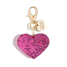 a pink heart shaped keychain with a ring attached to it's side