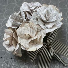 a bouquet of flowers made out of old book pages