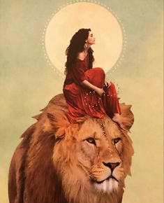 a woman is sitting on top of a lion