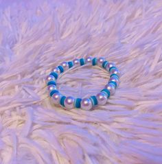 The Blue Bubble Bracelet is a clay bead bracelet that has pearls and different shades of blue shown across the clay beads. Adjustable Blue Pearl Beaded Bracelets, Bubble Bracelet, Clay Bead Bracelet, Different Shades Of Blue, Clay Bead, Bracelet Blue, Clay Beads, Bead Bracelet, Pearl Beads