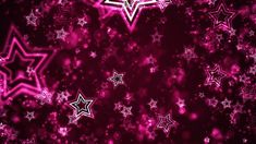 pink and white stars on a black background