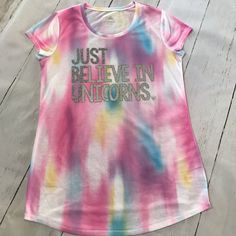 Girls Tie Dye Short Sleeve Tee Shirt From Justice. Size 18 “Just Believe In Unicorns” On Front In Glitter Brand New Without Tags. Has Never Been Worn Comes From A Smoke And Pet Free Pink Glitter Print Short Sleeve T-shirt, Pink Letter Print Tops For Playwear, Pink Graphic Print Top For Sleepover, Pink Casual Tops For Sleepover, Casual Unicorn Print T-shirt For Spring, Pink Glitter Print Crew Neck Top, Pink Tops For Sleepover In Spring, Pink Tops For Spring Sleepover, Cute Tie Dye Tops With Letter Print