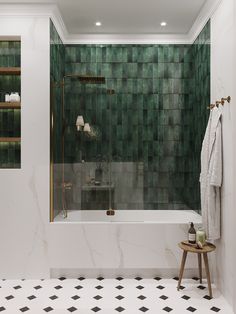 a bathroom with green tiles on the wall and white bathtub next to a black and white checkered floor