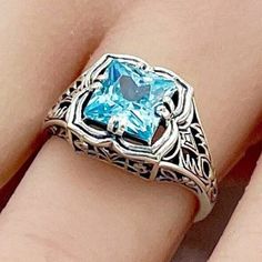 Vintage Sparkly Vivid Blue Princess Cut Simulated Aquamarine In 925 Solid Sterling Silver Filigree Ring. Excellent Condition, Satisfaction Guaranteed! Blue Filigree Ring As Fine Jewelry Gift, Gift Topaz Ring With Intricate Design, Blue Filigree Ring As A Gift, Blue Sterling Silver Filigree Ring For Anniversary, Sterling Silver Rings With Intricate Design In Blue, Sterling Silver Rings With Intricate Blue Design, Sterling Silver Ring With Intricate Blue Design, Blue Sterling Silver Rings With Intricate Design, Classic Blue Filigree Ring