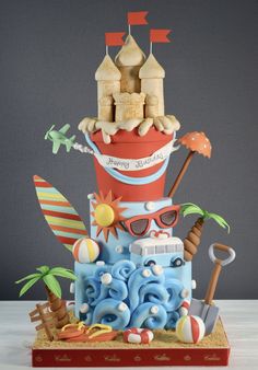 a birthday cake made to look like a beach scene