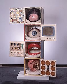 an assortment of fake mouths and eyeballs are displayed in a cubed display case