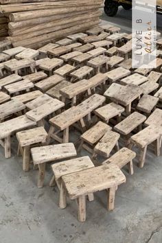 wooden tables and benches made out of wood planks are arranged in a large pile