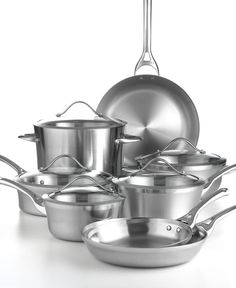 an assortment of stainless steel pots and pans