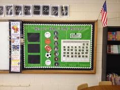 a bulletin board is hanging on the wall in a school room with american flags and other decorations