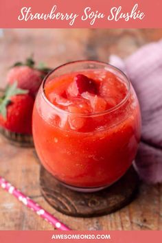 strawberry souffle slushie in a glass with strawberries on the side