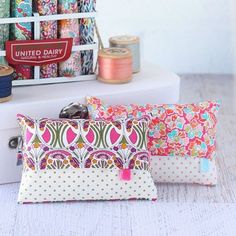 three different types of sewing supplies sitting on a table