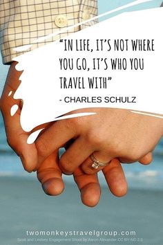 two people holding each other's hands with a quote above them that says, in life, it's not where you go, it's who you travel with