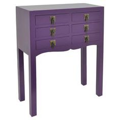 a purple table with three drawers on each side and two brass pulls at the top