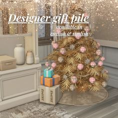 a christmas tree with presents under it and the words designer gift pile available in english and spanish