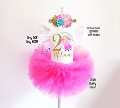 a pink tutu skirt with the number two on it and an image of a unicorn